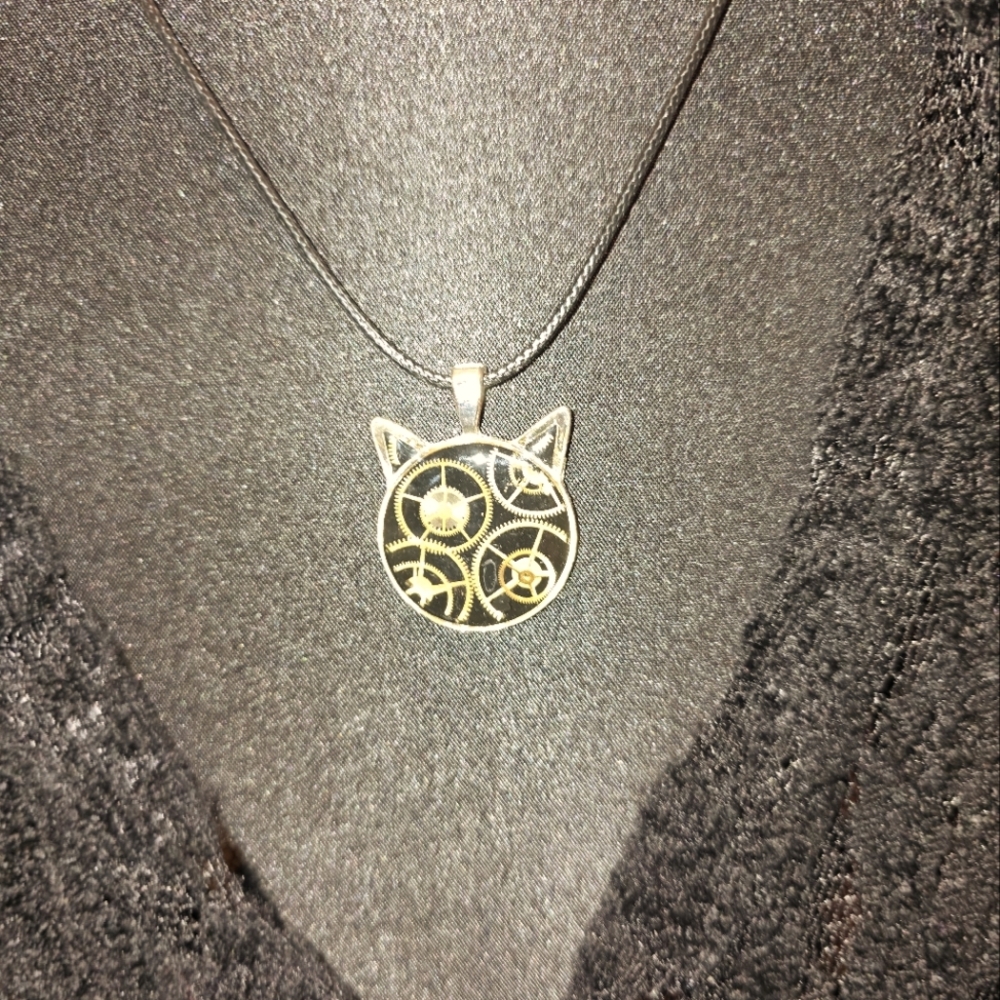 Perfect for cat lovers? Steampunk type geared cat shaped necklace.